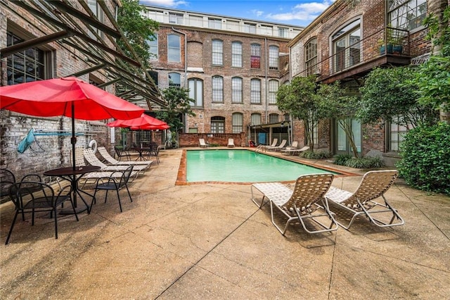 920 Poeyfarre St Unit 161, New Orleans, LA 70131 - community pool featuring a patio area