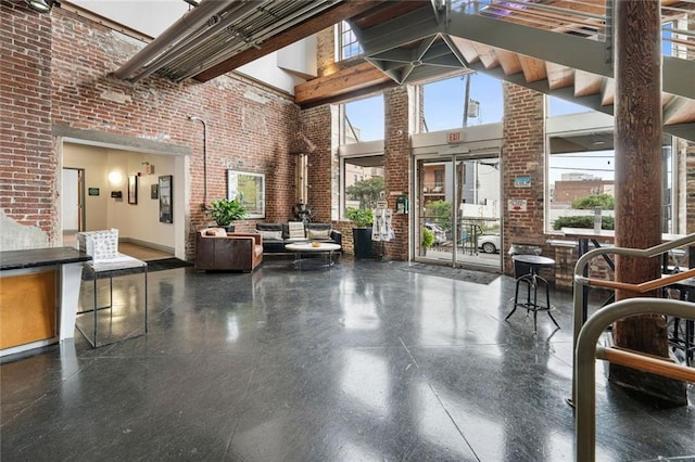 920 Poeyfarre St Unit 161, New Orleans, LA 70131 - community lobby featuring a high ceiling and brick wall