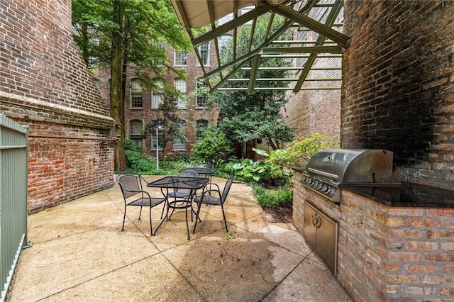 920 Poeyfarre St Unit 161, New Orleans, LA 70131 - view of patio with outdoor dining area and an outdoor kitchen