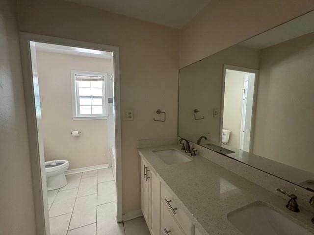 372 W 5th St, La Place, LA 70068 - full bathroom with double vanity, tile patterned flooring, and a bath