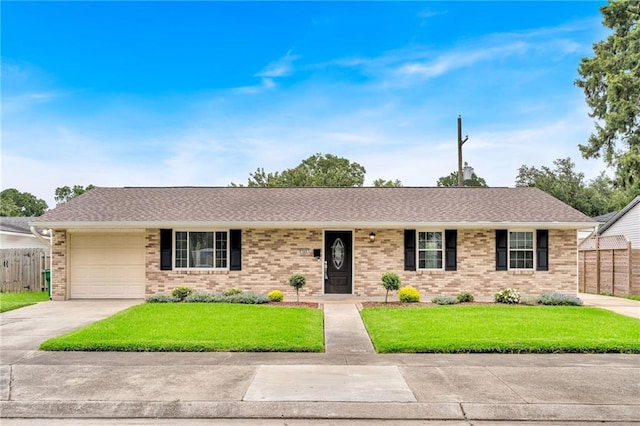 566 Welham Loop, La Place, LA 70068 - single story home featuring a garage, brick siding, driveway, and a shingled roof