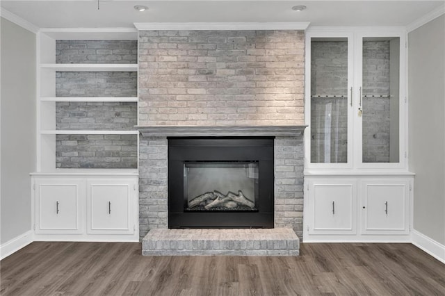 566 Welham Loop, La Place, LA 70068 - detailed view of wood finished floors, a fireplace, and ornamental molding