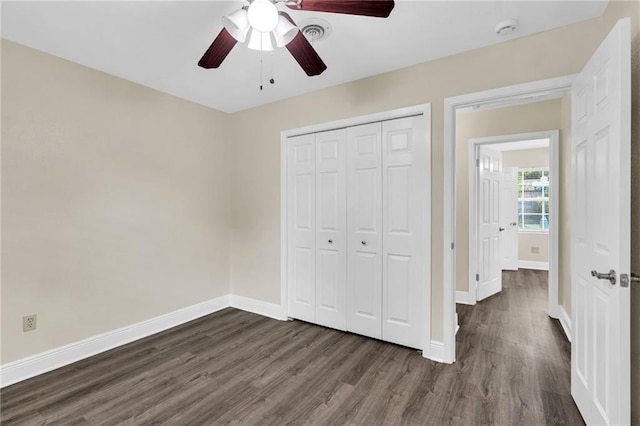 566 Welham Loop, La Place, LA 70068 - unfurnished bedroom featuring dark wood-type flooring, a closet, and ceiling fan