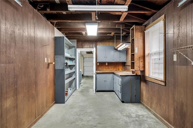 566 Welham Loop, La Place, LA 70068 - basement featuring wooden walls and baseboards