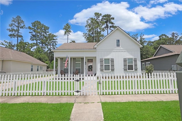 1537 Darlington St, Covington, LA 70433 - view of front of home with a gate, board and batten siding, a fenced front yard, and covered porch