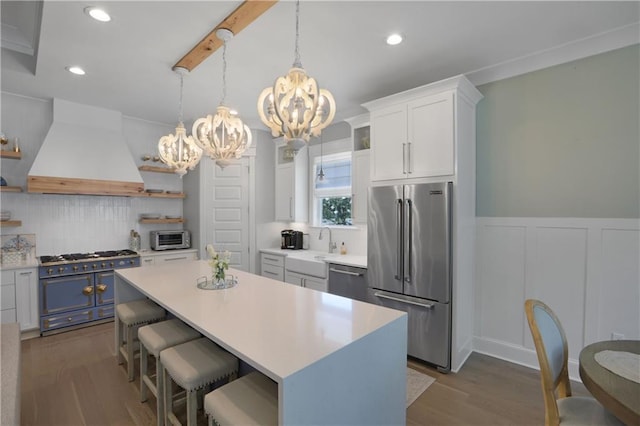 1537 Darlington St, Covington, LA 70433 - kitchen featuring premium appliances, custom exhaust hood, open shelves, a chandelier, and recessed lighting