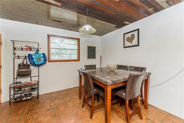 507 Elm St, Amite, LA 70422 - dining room with brick flooring and wooden ceiling