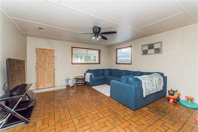 507 Elm St, Amite, LA 70422 - living area featuring brick patterned floors and a ceiling fan