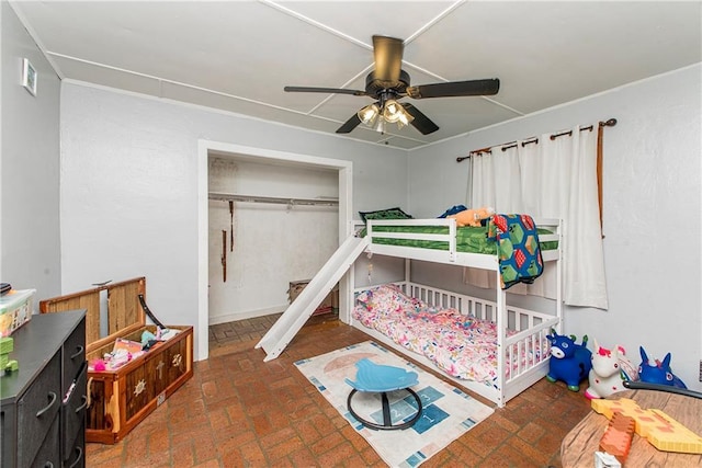 507 Elm St, Amite, LA 70422 - bedroom featuring brick floors, ceiling fan, and a closet