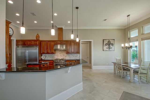 3012 Sunrise Blvd, Slidell, LA 70461 - kitchen with stainless steel built in refrigerator, under cabinet range hood, ornamental molding, dark countertops, and decorative backsplash