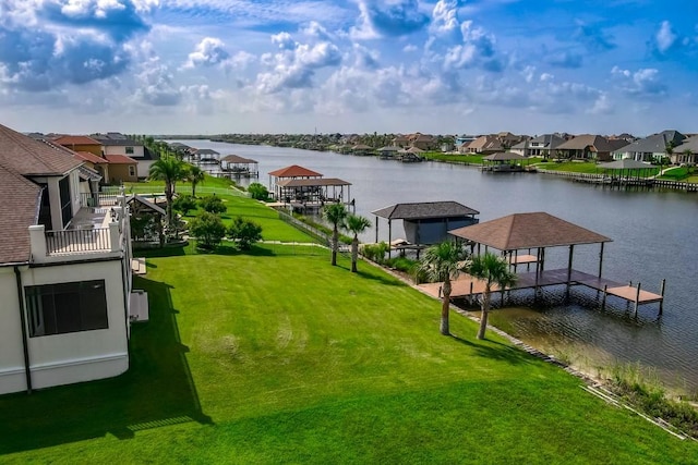 3012 Sunrise Blvd, Slidell, LA 70461 - view of grassy yard with a residential view, a water view, a boat dock, and a gazebo