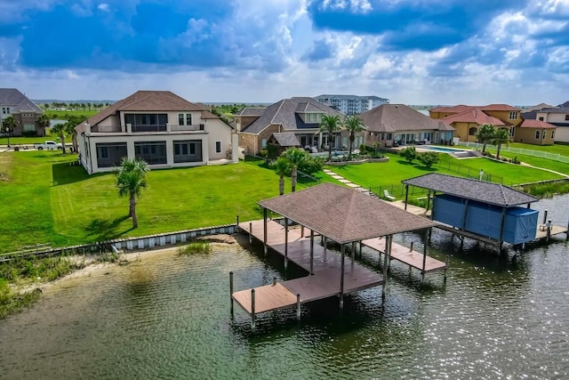 3012 Sunrise Blvd, Slidell, LA 70461 - dock area with boat lift, a water view, a residential view, and a yard