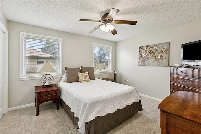 701 Mehle St, Arabi, LA 70032 - bedroom featuring a textured ceiling, light colored carpet, and a ceiling fan