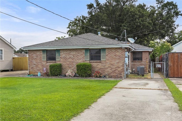 71315 Radiance St, Metairie, LA 70001 - bungalow-style house featuring a gate, brick siding, concrete driveway, and a shingled roof