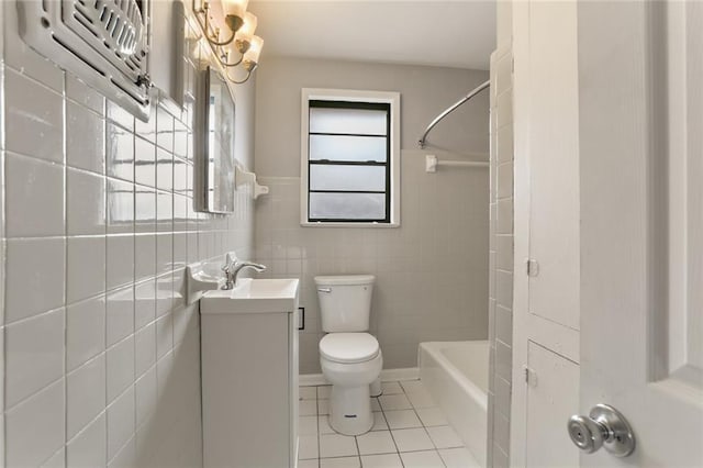 71315 Radiance St, Metairie, LA 70001 - full bath featuring tile patterned floors, vanity, tile walls, and bathing tub / shower combination