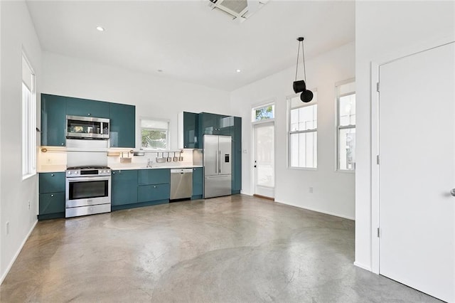 461 Ninth St, New Orleans, LA 70115 - kitchen featuring appliances with stainless steel finishes, plenty of natural light, concrete floors, and light countertops