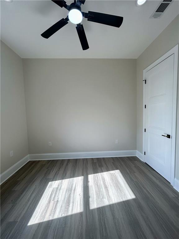 8111 Karen St, Metairie, LA 70003 - unfurnished room featuring ceiling fan and wood finished floors