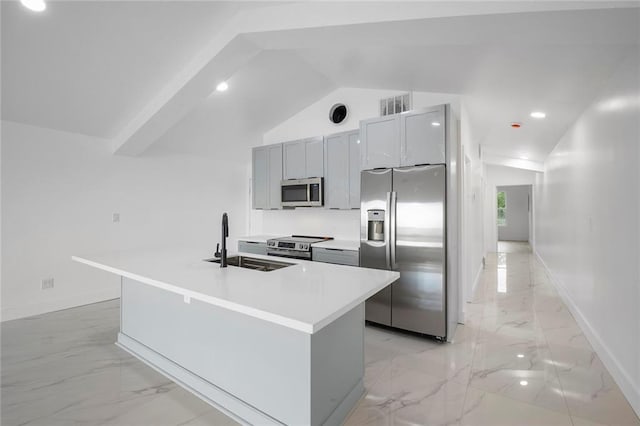 137 N Roadway St Unit 123, New Orleans, LA 70124 - kitchen featuring appliances with stainless steel finishes, light marble finish flooring, lofted ceiling, light countertops, and an island with sink
