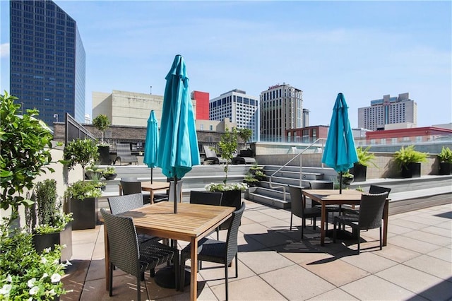 425 Notre Dame St Unit 201, New Orleans, LA 70130 - view of patio with outdoor dining area and a view of city