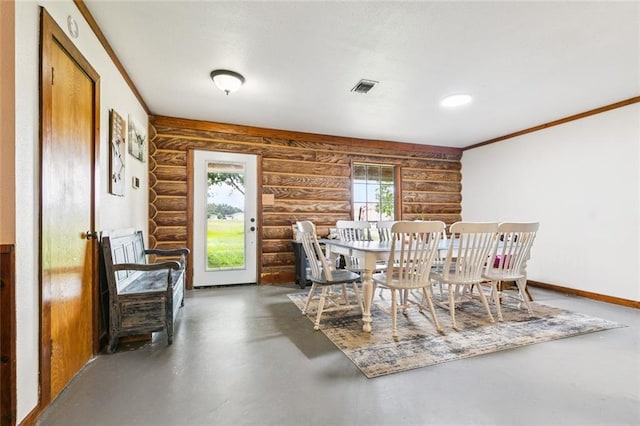12228 23rd Hwy, Belle Chasse, LA 70037 - dining space featuring rustic walls, concrete flooring, and ornamental molding