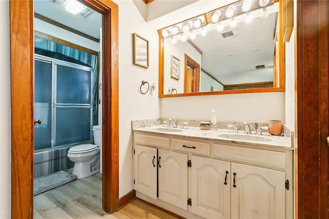 12228 23rd Hwy, Belle Chasse, LA 70037 - bathroom with wood finished floors, double vanity, and shower / bathtub combination