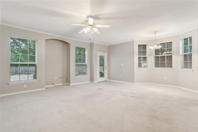 517 Spartan Dr Unit 8103, Slidell, LA 70458 - unfurnished room with a chandelier, crown molding, light colored carpet, a ceiling fan, and arched walkways