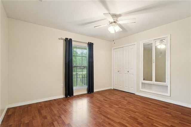 201 Walnut St, Covington, LA 70433 - unfurnished bedroom featuring wood finished floors and a ceiling fan