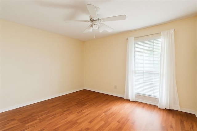 201 Walnut St, Covington, LA 70433 - empty room with light wood finished floors and a ceiling fan