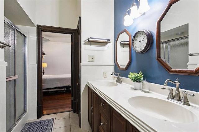 1718 Leon C Simon Dr, New Orleans, LA 70122 - ensuite bathroom featuring tile patterned floors and double vanity