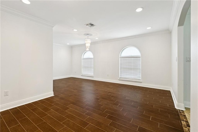 9962 E Wheaton Cir, New Orleans, LA 70127 - spare room featuring dark wood-style floors, crown molding, recessed lighting, and arched walkways