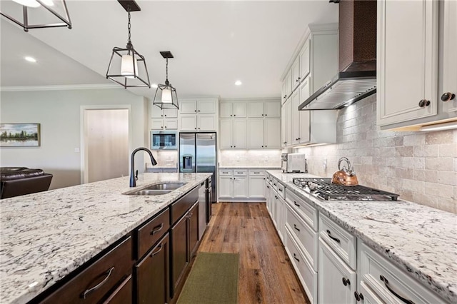 122 Highland Crest Dr, Covington, LA 70435 - kitchen with stainless steel appliances, wall chimney range hood, crown molding, recessed lighting, and dark brown cabinets