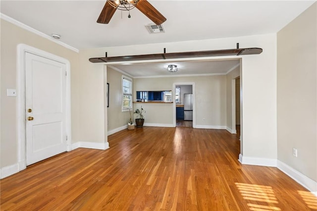 672729 Louis Xiv St, New Orleans, LA 70124 - unfurnished living room featuring a ceiling fan, light wood finished floors, and crown molding
