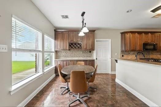 110 Woodchase Dr, Belle Chasse, LA 70037 - dining room featuring baseboards