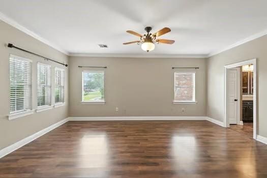 110 Woodchase Dr, Belle Chasse, LA 70037 - unfurnished room with crown molding, healthy amount of natural light, wood finished floors, and a ceiling fan