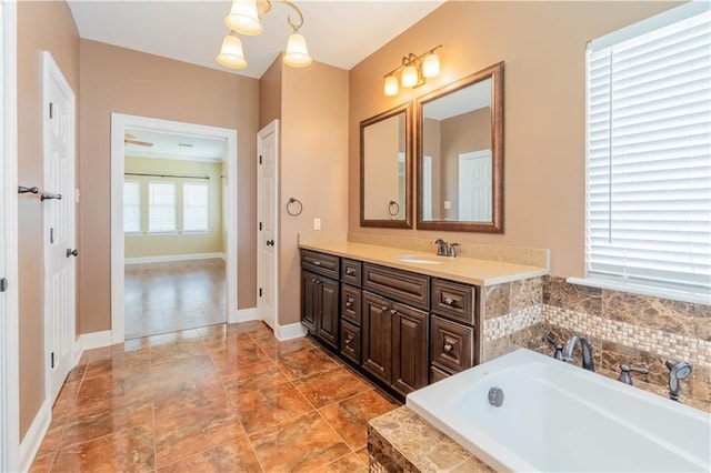 110 Woodchase Dr, Belle Chasse, LA 70037 - bathroom with vanity and a garden tub