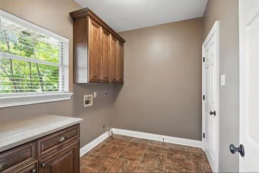 110 Woodchase Dr, Belle Chasse, LA 70037 - laundry room featuring hookup for a washing machine and cabinet space