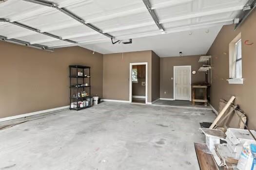 110 Woodchase Dr, Belle Chasse, LA 70037 - garage featuring a garage door opener