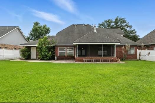 110 Woodchase Dr, Belle Chasse, LA 70037 - rear view of house with a sunroom and a fenced backyard