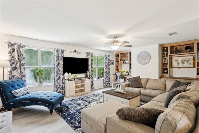 542 Huseman Ln, Covington, LA 70435 - living area with wood finished floors and a ceiling fan