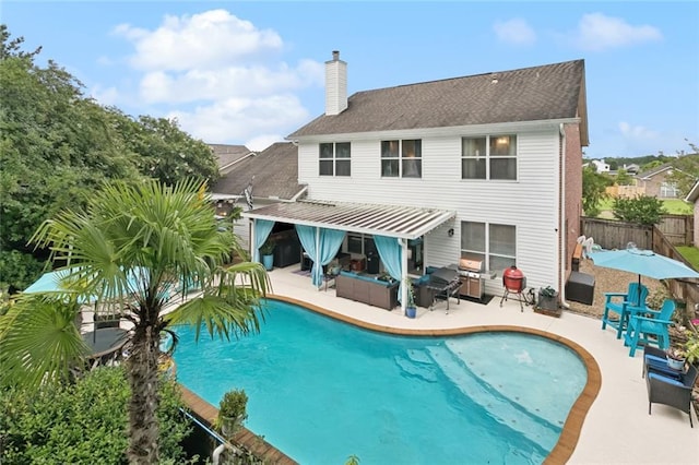 542 Huseman Ln, Covington, LA 70435 - back of property featuring a patio and a chimney