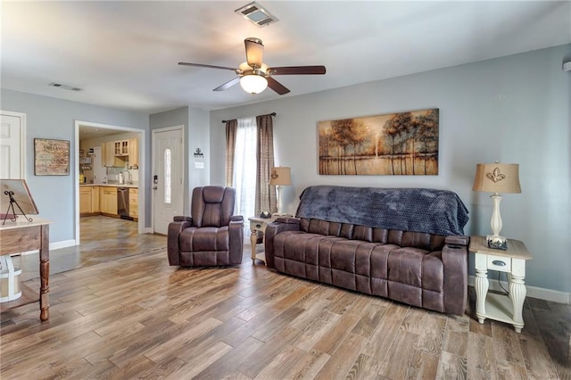 3039 College St, Slidell, LA 70458 - living room featuring light wood-style flooring and a ceiling fan