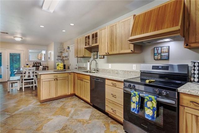 3039 College St, Slidell, LA 70458 - kitchen featuring stainless steel electric range oven, black dishwasher, premium range hood, a peninsula, and light stone finish floors