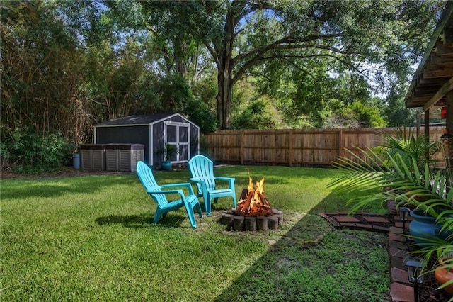 3039 College St, Slidell, LA 70458 - fenced backyard featuring a fire pit and a shed