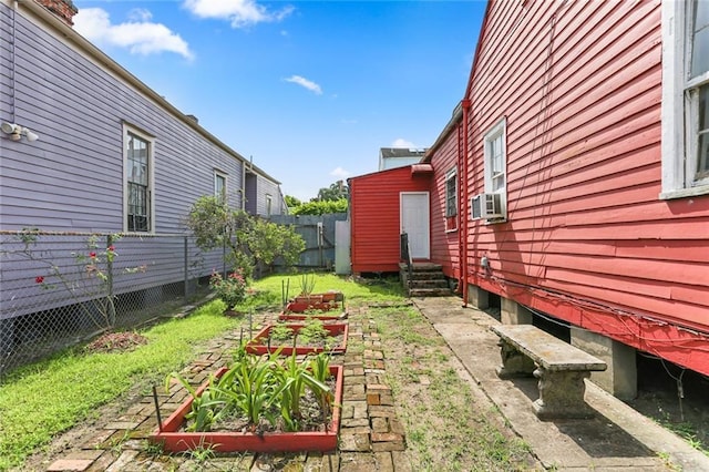 711 Montegut St, New Orleans, LA 70117 - view of yard with a garden and entry steps