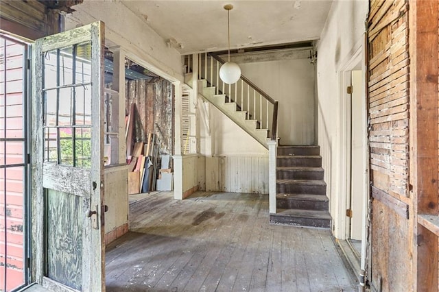 71113 Montegut St, New Orleans, LA 70117 - entryway featuring hardwood / wood-style flooring and stairs