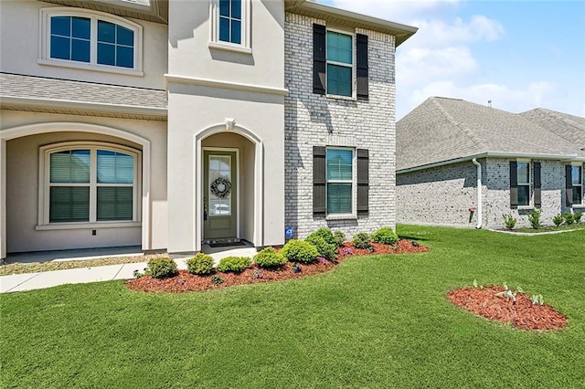 5681 Oakworth St, Slidell, LA 70461 - entrance to property with a lawn, stucco siding, and brick siding