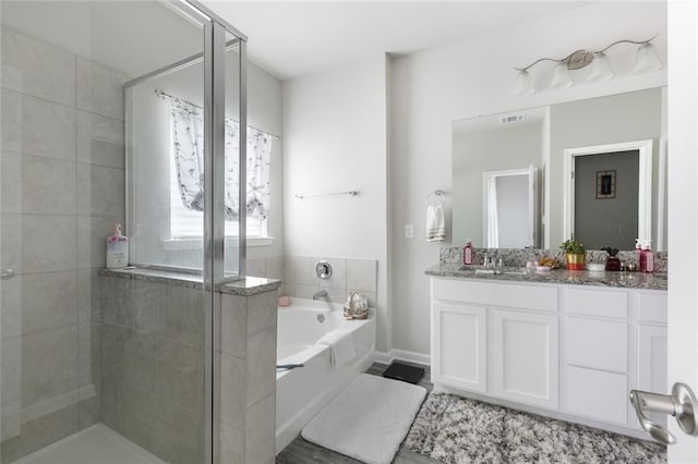 5681 Oakworth St, Slidell, LA 70461 - bathroom with a bath, vanity, and a stall shower