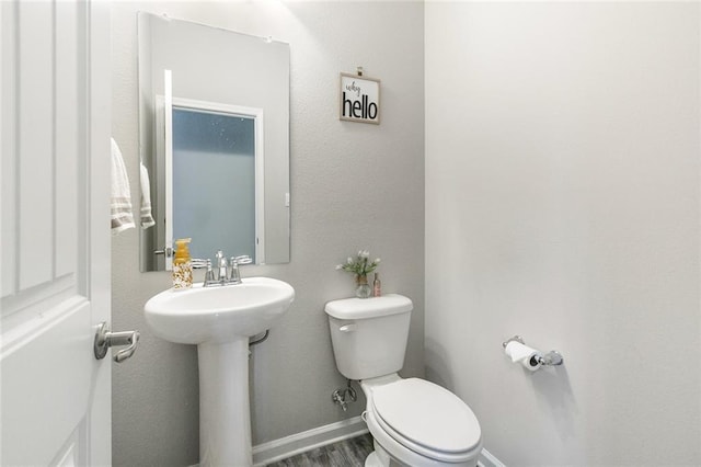 5681 Oakworth St, Slidell, LA 70461 - bathroom featuring toilet and wood finished floors