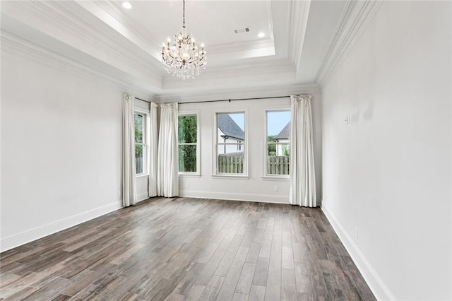 130 Bald Eagle Dr, Belle Chasse, LA 70037 - empty room with plenty of natural light, a chandelier, crown molding, dark wood-style flooring, and a raised ceiling
