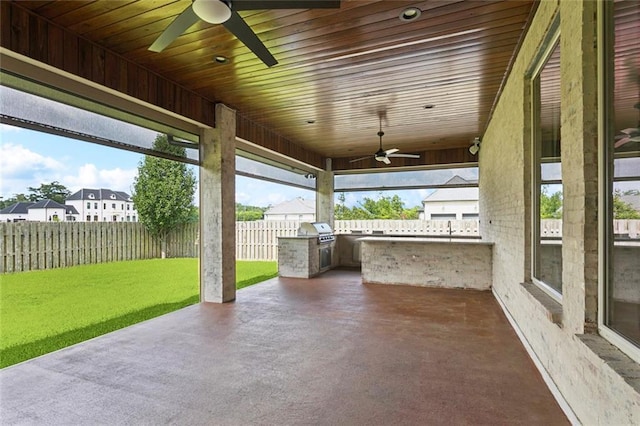 130 Bald Eagle Dr, Belle Chasse, LA 70037 - fenced backyard featuring ceiling fan, an outdoor kitchen, a patio, and a residential view